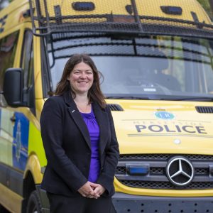 Emily Spurrell in front of a police van